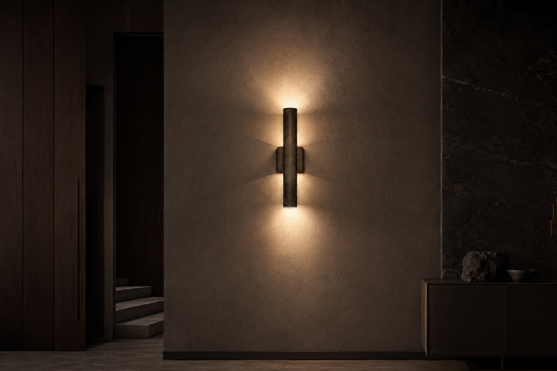 Modern wall sconce illuminating a dark premium interior